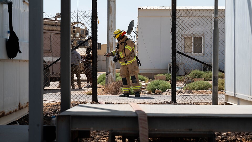 A 332d Air Expeditionary Wing firefighter preps his uniform during an exercise in an undisclosed location in the U.S. Central Command area of responsibility July 14, 2024. Firefighters are a vital part of the emergency response team at any base, with their ability to quickly put out fires, provide T