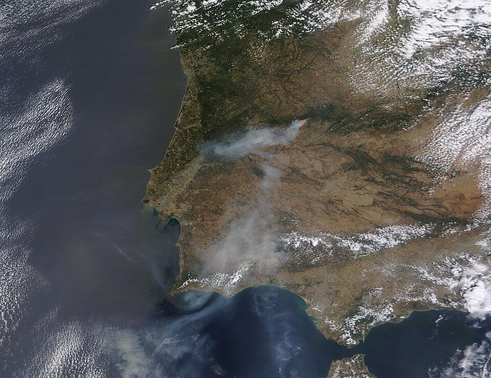 A massive wildfire was raging through dry forestland in western Spain on May 19, 2023, when the Moderate Resolution Imaging Spectroradiometer (MODIS) on NASA’s Terra satellite captured a true-color image of the scene. A large patch of red marks actively burning fire near Spain’s border with Portugal