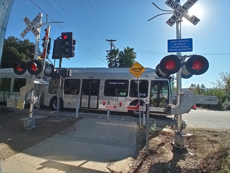 The Hayvenhurst Crossing in Los Angeles, where the Los Angeles Metro Busway's G Line crosses a bike path that connects Lake Balboa Drive to the Metro G Line Bikeway and Victory Boulevard at Hayvenhurst Avenue. The crossing is controlled by vehicular signal heads, pedestrian signal heads, crossing ga