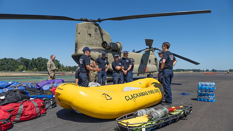 Oregon Army National Guard aviators from B Company, 1st Battalion, 168th Aviation Regiment partnered with Clackamas Fire's Water Rescue Team at Aurora State Airport on July 24, 2025, for specialized load-and-go flood response training. The exercise focused on developing efficient procedures for rapi