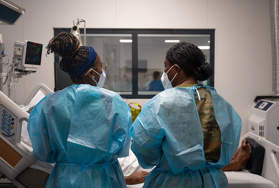 Capt. Kay Mulbah, 931st Aerospace Medical Squadron nurse, right, assists in administering medication to a patient during AMISTAD 2025 at Academic Hospital Paramaribo, Suriname, July 23, 2025. By integrating with local medical providers during the two-week global health engagement, Mulbah was able to