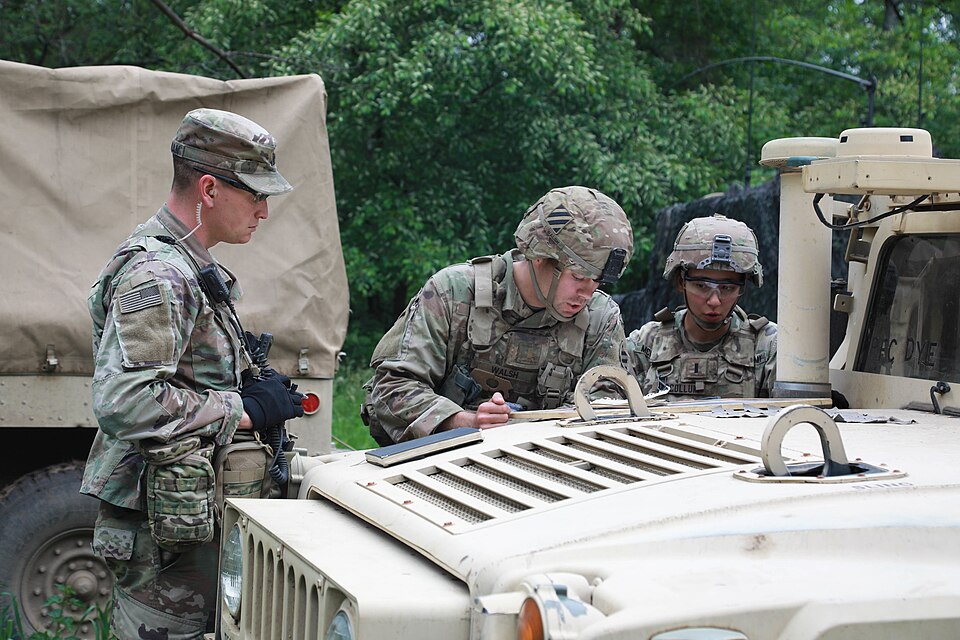 U.S. Army Capt. Daniel Faughnan, Observer Coach/Trainer assigned to the Joint Multinational Readiness Center, takes notes on the performance of a training unit during military exercise Defender Europe 20, at Drawsko Pomorskie Training Area, Poland on June 11, 2020. Exercise Allied Spirit, a Defender