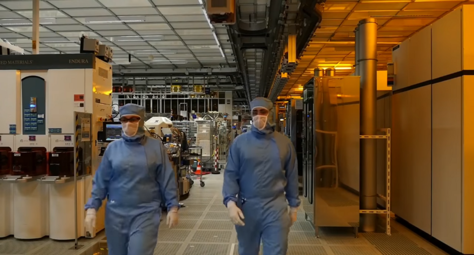 screenshot of the video, interior of a manufacturing industry of STMicroelectronics, a cleanroom for Semiconductor device fabrication.