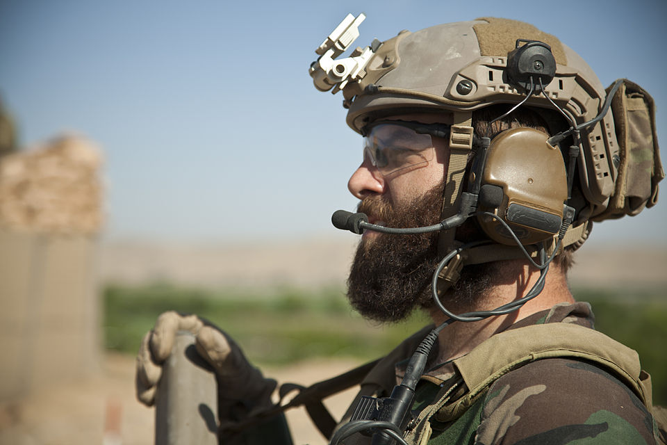 A U.S. Special Operations Marine provides security for Afghan National Army special forces soldiers and Afghan Local Police members building a checkpoint in Helmand province, Afghanistan, April 3, 2013. The Afghan Local Police was tasked with serving rural areas with limited Afghan National Security