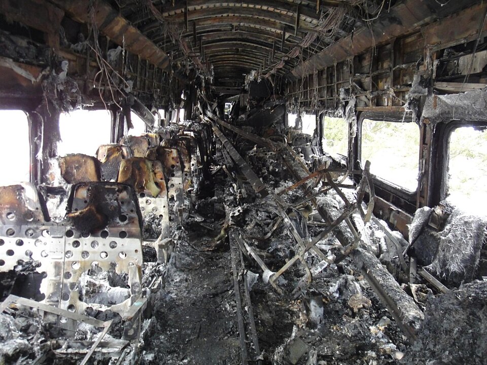 Interior of the lead car in the 2015 Valhalla train crash, some time after accident, showing fire damage and third rail sections dislodged into car during accident.