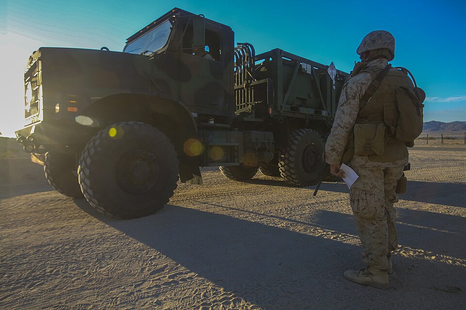 U.S. Marine Corps Pfc. Nathan T. Williams, a military police officer with the 1st Law Enforcement Battalion, I Marine Expeditionary Force Headquarters Group, calls into a command operation center to request entry clearance for a 7-ton medium tactical vehicle Aug. 5, 2014, during Large Scale Exercise