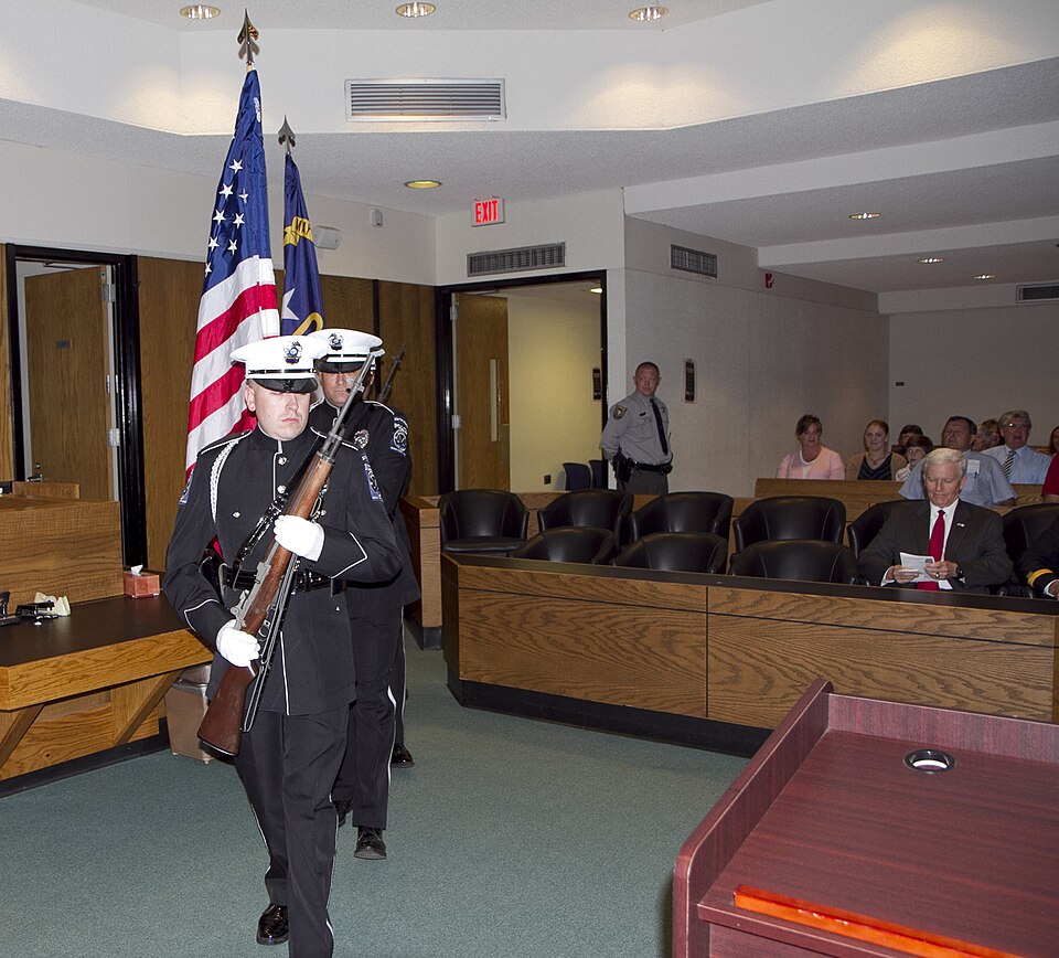 The Mooresville Police Department Color Guard enters the court room during for the presentation cere