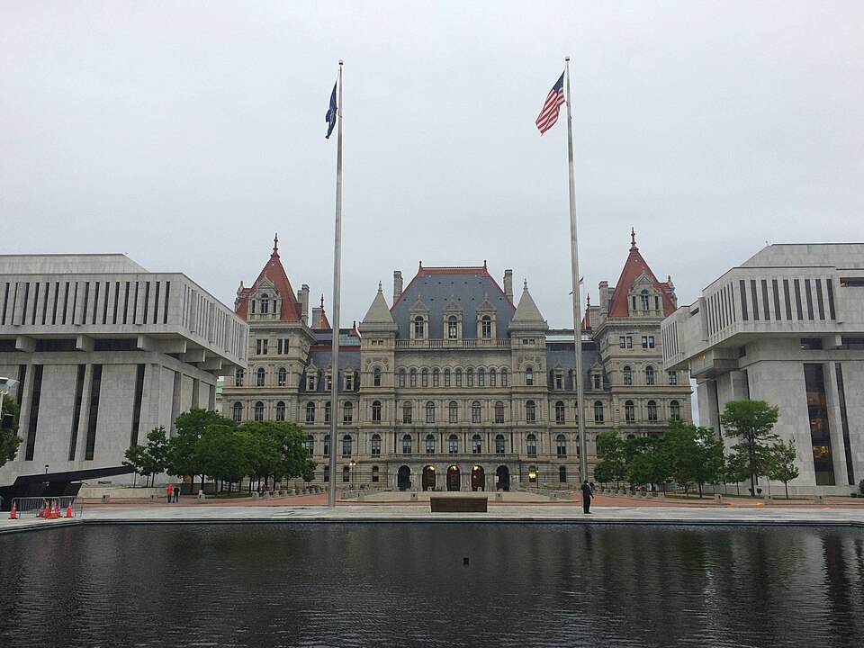 View from the northeast end of Empire State Plaza across State Street. The New York State Capitol (Thomas Fuller, Leopold Eidlitz, Isaac G. Perry, and H. H. Richardson, 1899) is flanked by the Legislative Office Building at left and the Robert Abrams Building for Law and Justice at right (both by Ha