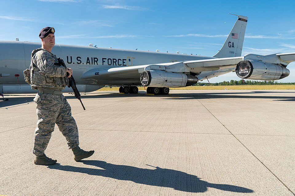 U.S. Air Force Tech. Sgt. Kyle Crook, a security forces specialist with the 78th Air Base Wing (ABW), Robins Air Force Base, Georgia, walks a perimeter in front on a E-8C Joint STARS at Fighter Wing Skrydstrup, Denmark, June 8, 2018. The 78th ABW provided security for the E-8C Joint STARS during the