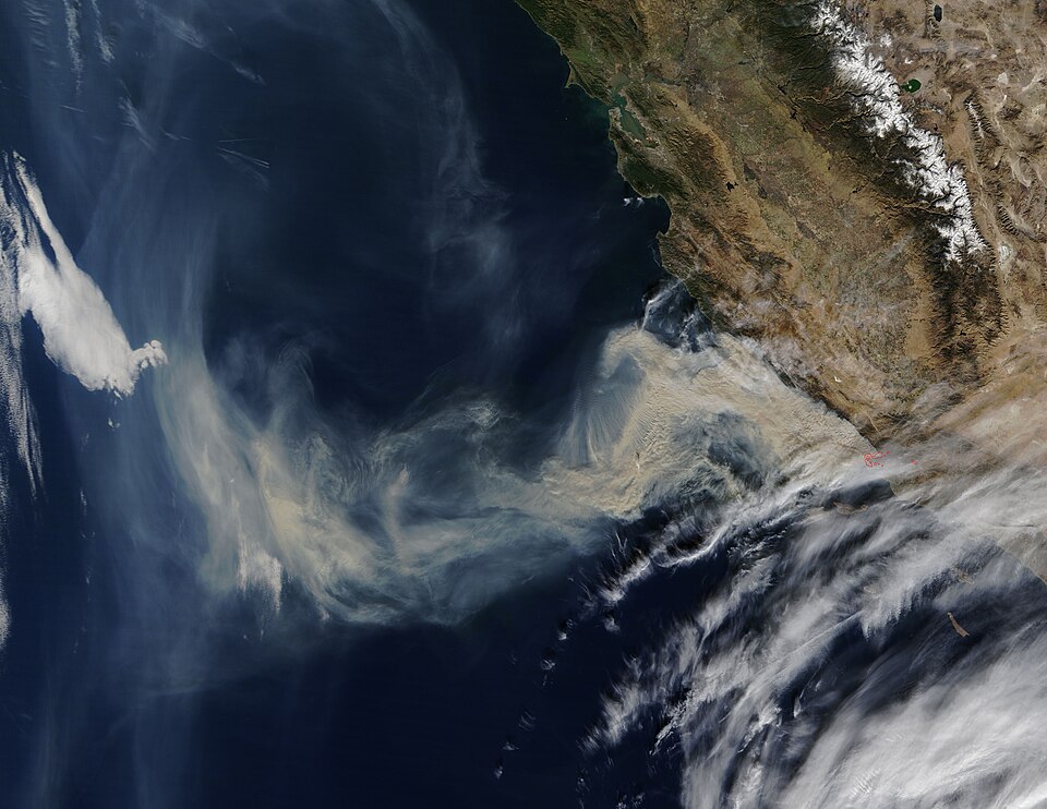 A thick brown river of smoke poured from fierce fires burning in Southern California and blew over the Pacific Ocean on December 11, 2017. The Moderate Resolution Imaging Spectroradiometer (MODIS) aboard NASA’s Terra satellite acquired a true-color image of the scene on that same day.
Most of the sm