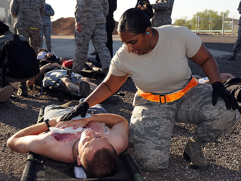 U.S. Air Force Senior Airman Sharla Iseah, 355th Dental Squadron, talks to a victim of a simulated aircraft crash during an emergency medical exercise of Angel Thunder at Davis-Monthan Air Force Base, Ariz., April 13, 2013. Each victim that was transported by Tucson emergency medical responders was 
