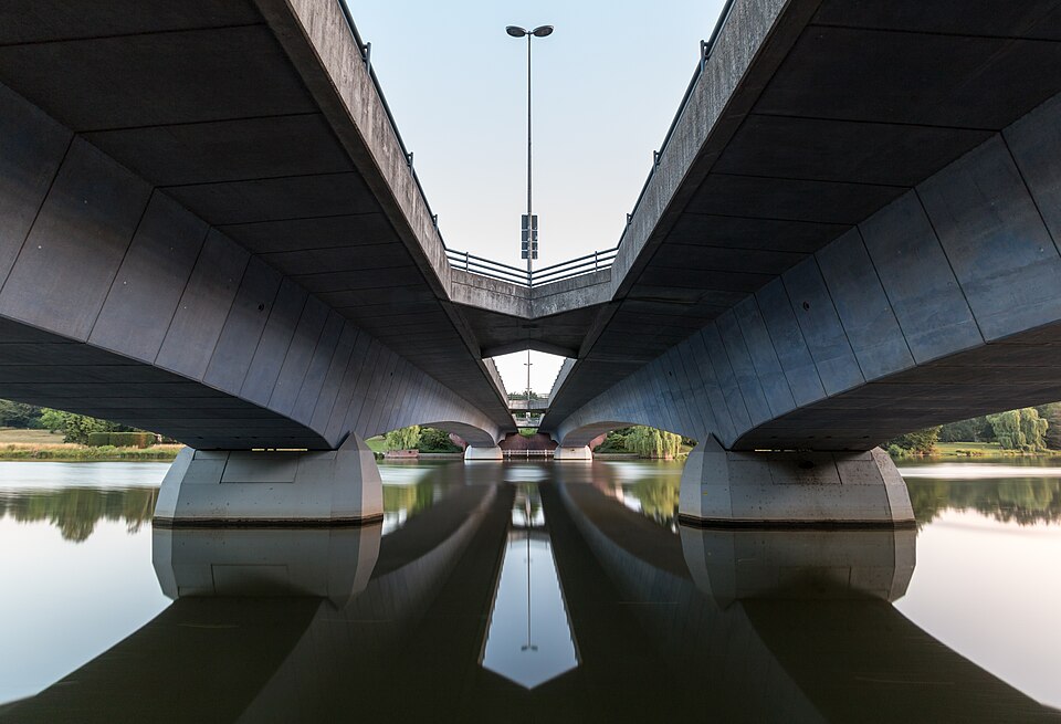 Tormin Bridge (at sunrise), Münster, North Rhine-Westphalia, GermanyThe 145-meter-long Tormin Bridge is a pedestrian and bicycle bridge in Münster. It spans the Aasee lake and connects parts of the city center with adjacent residential and green areas.It was built in the 20th century as part of urba
