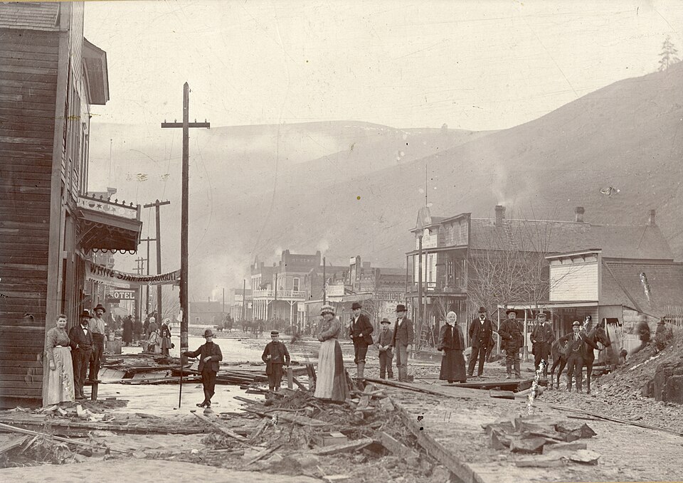 Production Date: January 12, 1900
Source Type: Photograph
Printer, Publisher, Photographer: Unknown
Postmark: Not Applicable
Collection: Steven R. Shook
Remark: A hotel and the White Star Restaurant are visible along the left side of this photograph. The majority of the structures seen in this photo