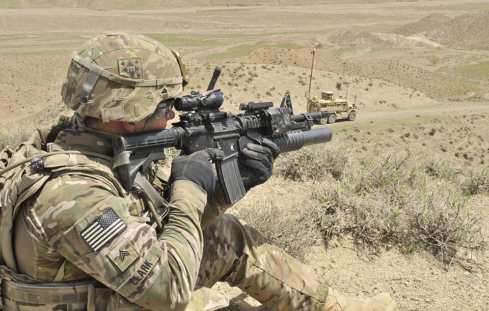 Sgt. Joshua J. Clark, from Elkhart, Ind., with the 591st Engineer Company (Sappers), provides over watch security for Air Force Explosive Ordinance Disposal personnel outside an Afghan Border Police checkpoint near the Afghanistan-Pakistan border April 1 in Spin Boldak district, Kandahar province, A