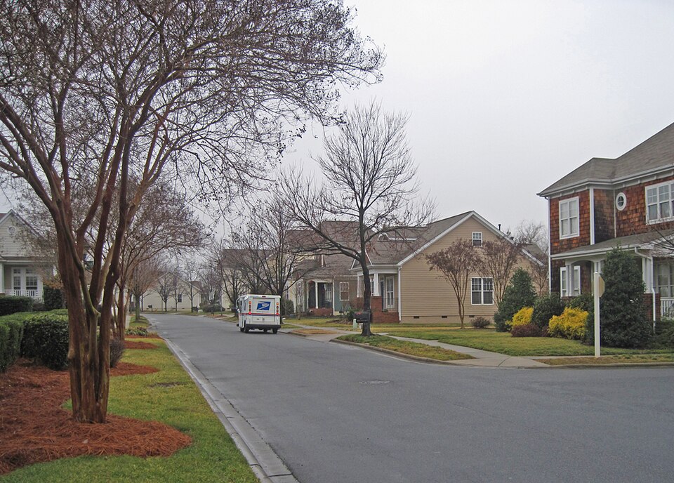 Mail truck going through Birkdale Village street.  All mailboxes are in a rural suburban style at th