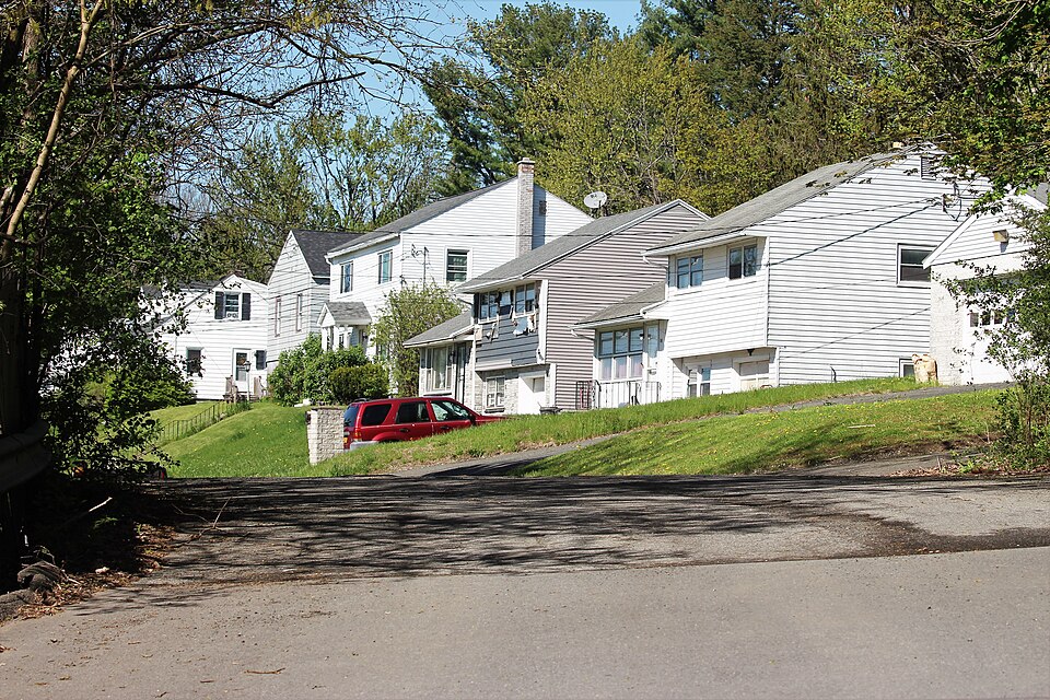 A suburban street at the corner of 7th Avenue &amp; 120th Street in the city of Troy, Rensselaer County, New York, dated May 6, 2021. This area is part of the Lansingburgh neighborhood.