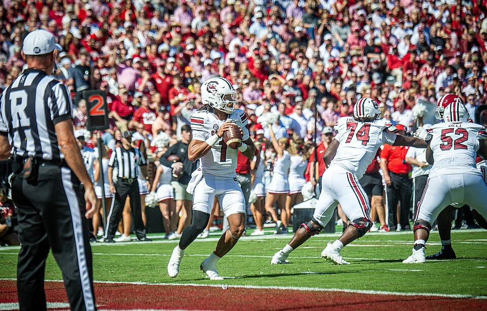 Four U.S. Army AH-64E Apache attack helicopters assigned to Alpha Company, 1-151 Attack Battalion, 59th Aviation Troop Command, South Carolina Army National Guard, perform a flyover for the Alabama vs. South Carolina football game, Saban Field at Bryant-Denny Stadium, Tuscaloosa, Alabama, Oct. 12, 2