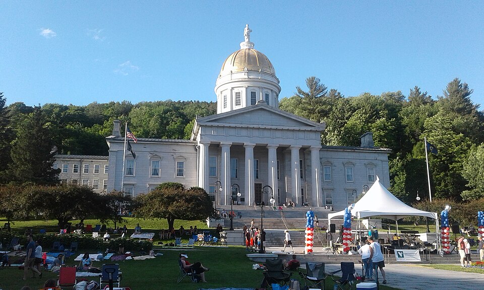 Vermont state house on State Street in downtown Montpelier, Vermont during Independence Day parade.