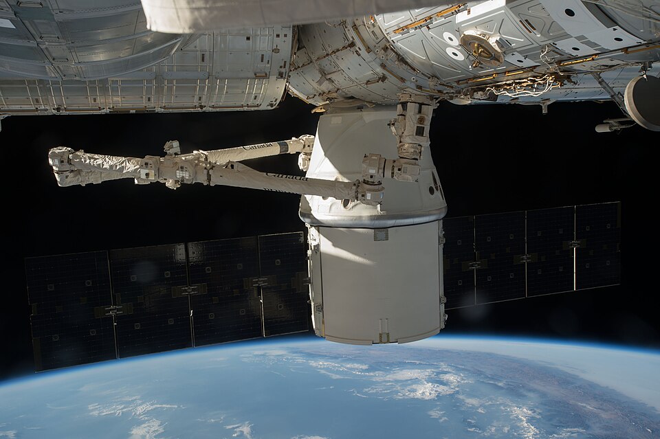 The SpaceX Dragon is attached to the International Space Station, while inside the station the crew of Expedition 48 continue to off load the nearly 5000 pounds of supplies, hardware and experiments.