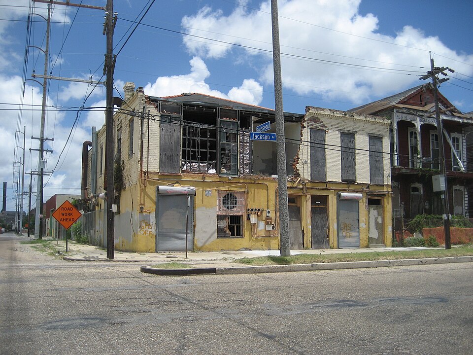 New Orleans: Building at downtown river corner of Jackson Avenue &amp; Rousseau Streets, Irish Chanel neighborhood, Uptown New Orleans. In early 20th century, early jazz notables the Brunies Brothers lived here per SOARDS city directories.  Before Hurricane Katrina building housed a laundromat. It w