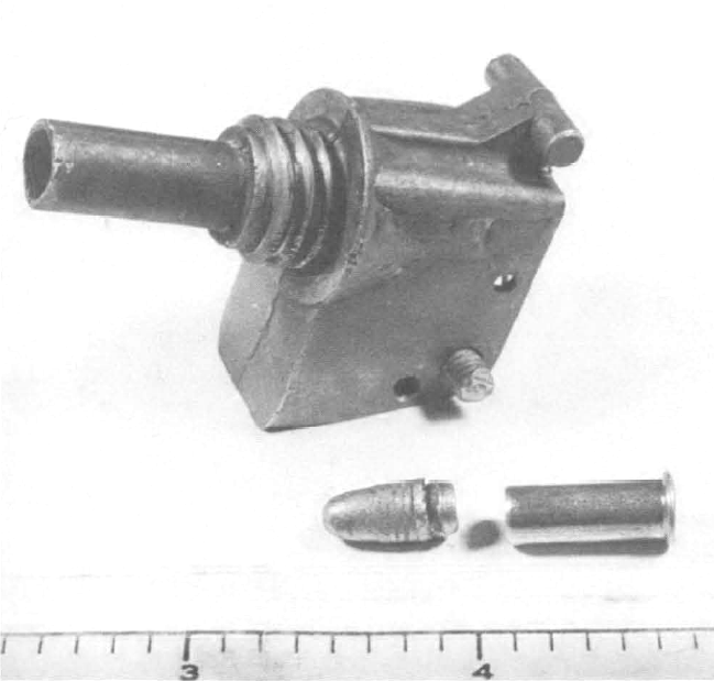 .22-Caliber Weapon Made From Detonator Top.
This homemade weapon was found by an 8-year-old boy in a residential area of Oceanside, Calif.
The weapon was made by taking the detonator top of a hand grenade, drilling out the primer, and inserting a .22-caliber bullet. The spring-loaded firing pin was 