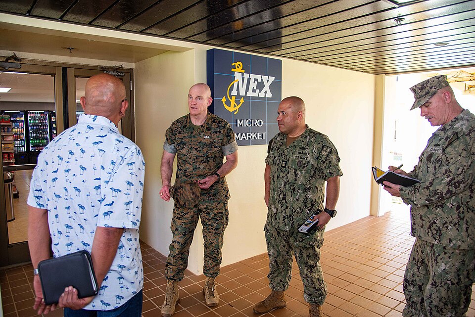 250324-N-ML137-1033 NAVAL BASE GUAM (March 24, 2025) Senior Enlisted Advisor to the Chairman (SEAC) U.S. Marine Corps Sgt. Maj. Troy Black speaks with Roy Meno, unaccompanied housing manager for Naval Base Guam, U.S. Navy Command Master Chief Miguel Lugo, senior enlisted leader of NBG, and Command M