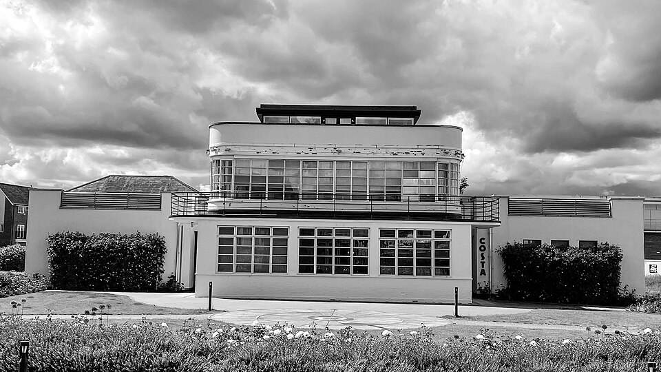 GV II Control tower. 1939-40, to 1939 Watch Office with Meteorological Section design by Air Ministry's Directorate of Works. Drawing no. 5845/39. Painted brickwork walls, reinforced concrete floors and roof, with asphalt finish.
PLAN: a near-square plan on three floors with wide glazed balconies fa