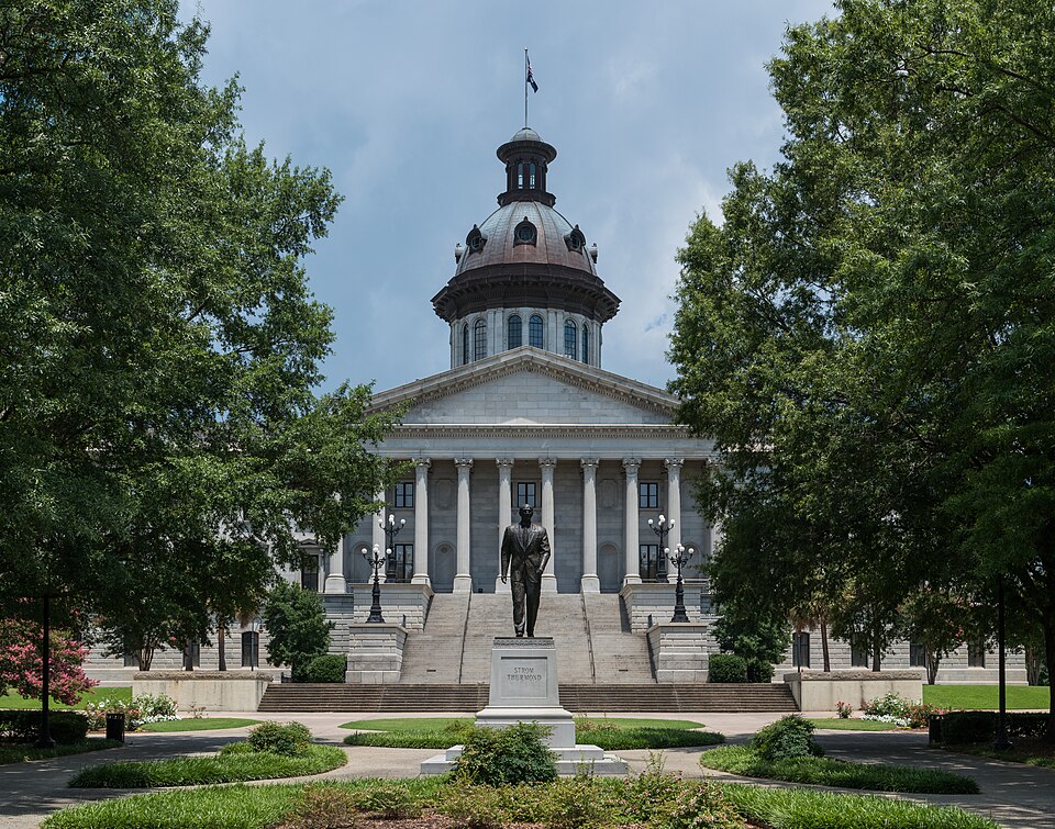 A southeast view of the South Carolina State House and the Strom Thurmond statue, Columbia