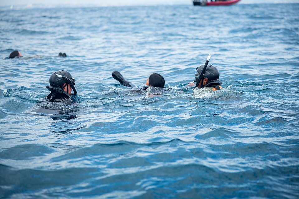 U.S. Marines rescue a simulated casualty during a Maritime Operators (MOP) course off the coast of Okinawa, Japan, April 1, 2025. The MOP course is a six-week, multi-phase course that includes open water safety swimmer, scout swimmer, maritime navigation, combat rubber raiding craft operator, and fu
