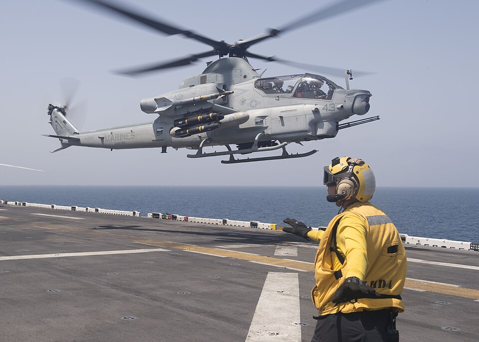 160605-N-YR245-112 STRAIT OF HORMUZ (June 5, 2016) Aviation Boatswain’s Mate (Handling) Airman Scott Melton signals an AH-1Z Viper helicopter, assigned to the 13th Marine Expeditionary Unit (13th MEU), to take off from the flight deck of the amphibious assault ship USS Boxer (LHD 4). Boxer is the fl
