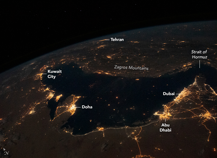The Persian Gulf forms the center of this photograph taken by an astronaut from the International Space Station (ISS). The nighttime lights mark the larger cities and highways of Bahrain, Iran, Iraq, Kuwait, Qatar, Saudi Arabia, and the United Arab Emirates. The brightest lights are concentrated alo
