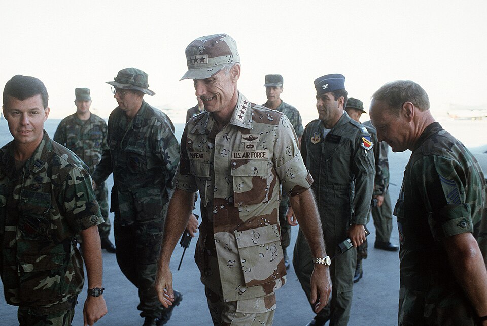Air Force Chief of Staff General Merrill McPeak inspect U.S. Air Force personnel deployed in the Middle East during Operation Desert Shield.