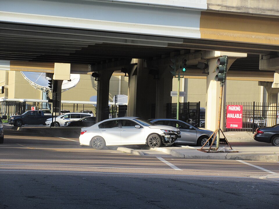 New Orleans. Car crashed into and knocked down traffic light at Barronne Street entrance to Pontchartrain Expressway.