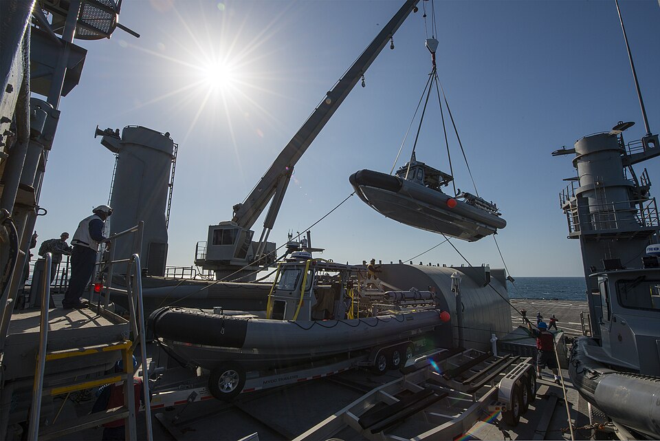 A rigid-hull inflatable boat is lifted from the deck aboard the afloat forward staging base (interim) USS Ponce (AFSB(I)15) during exercise Spartan Kopis Dec. 9, 2013, at Naval Support Activity Bahrain. Spartan Kopis was a U.S. 5th Fleet training event that validated the effectiveness of using joint