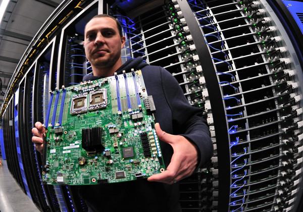 Facebook engineer Joshua Crass holds up a server board he and his team installed at the new data center. The exact number of dual-socket boards is proprietary, but it's "many tens of thousands."
Intel Free Press story: A Peek Inside Facebook's Oregon Data Center. Tens of thousands of energy-efficien