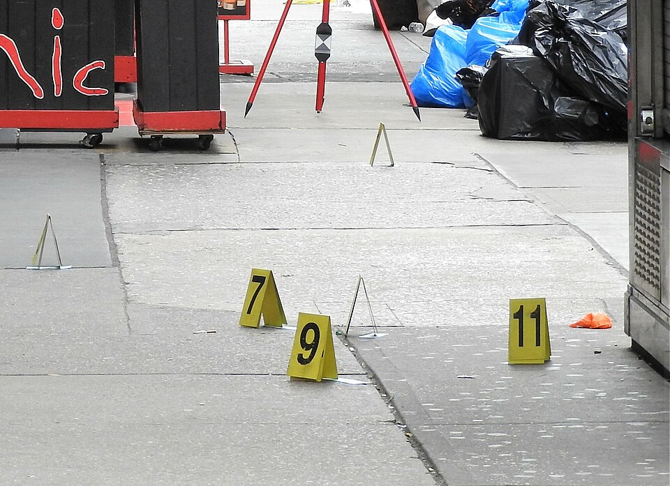 Looking south at evidence markers after a man was shot dead in a bar.